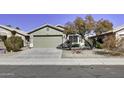Single-story house featuring a two-car garage and a paved driveway at 2234 E 37Th Ave, Apache Junction, AZ 85119