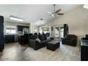 Open-concept living area with kitchen, vaulted ceilings, and sliding doors to the backyard at 2234 E Stephens Rd, Gilbert, AZ 85296
