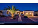 Beautiful desert home with attractive landscaping and a three-car garage at 22819 N Del Monte Dr, Sun City West, AZ 85375