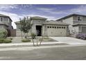 One-story home with a two-car garage and desert landscaping at 25574 N 164Th Ave, Surprise, AZ 85387