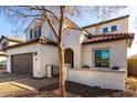 Two-story house with a tree in front and a light-colored stucco at 3057 E Trigger Way, Gilbert, AZ 85297