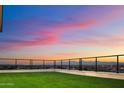 Rooftop terrace with artificial turf and city views at sunset at 6516 E Meadowlark Ln, Paradise Valley, AZ 85253