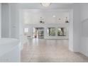 Spacious living room with tile floors and seamless access to the outdoors at 7735 E Russell Cir, Mesa, AZ 85207