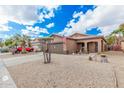 House exterior with a red truck parked in the driveway at 830 E Tortoise Trl, San Tan Valley, AZ 85143