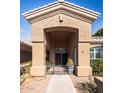 Welcoming front entrance with a covered porch, security gate, and well-maintained landscaping at 1626 E Kathleen Rd, Phoenix, AZ 85022