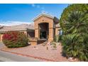 Inviting front entrance with desert landscaping, including vibrant plants and decorative rocks at 1626 E Kathleen Rd, Phoenix, AZ 85022