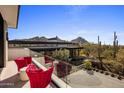 Private balcony with glass railings and mountain views at 27951 N 96Th Pl, Scottsdale, AZ 85262
