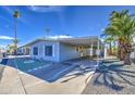 Attractive one-story home complete with covered parking, a neat landscape, and mature palm trees offering shade and appeal at 3104 E Broadway Rd # 4, Mesa, AZ 85204