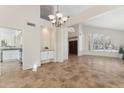 Bright dining area with tile floors and access to the kitchen at 3435 E Desert Trumpet Rd, Phoenix, AZ 85044