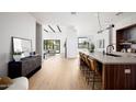 Bright and airy living space featuring hardwood floors, open layout, and stylish decor with easy access to the outdoors at 4445 E Roma Ave, Phoenix, AZ 85018