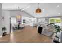 Expansive open-concept living room with a dining area, large kitchen, and bright, airy atmosphere at 9136 N 81St St, Scottsdale, AZ 85258