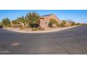 Street view of a corner home with desert landscaping, mature trees, and visible neighborhood at 1808 E Crocus Ave, Queen Creek, AZ 85140