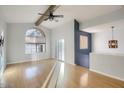 Spacious living room with vaulted ceilings, exposed beam, lots of natural light and hardwood floors at 1905 E University Dr # 216, Tempe, AZ 85288