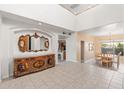 Elegant entryway with a decorative console table and mirrors at 21004 N 53Rd Ave, Glendale, AZ 85308
