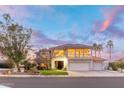 Two-story home with a three-car garage and landscaped front yard at 21004 N 53Rd Ave, Glendale, AZ 85308