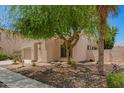 Inviting exterior showcasing desert landscaping, a charming facade, and a well-maintained walkway at 4286 E Buckboard Rd, Gilbert, AZ 85297