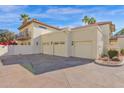 Spacious three-car garage and second story balcony with lush, mature landscaping at 5018 E Siesta Dr # 3, Phoenix, AZ 85044