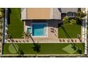 Aerial shot of modern home showcasing the pool, lounge, and well-manicured landscaping at 6302 E Hillcrest Blvd, Scottsdale, AZ 85251