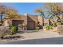 Charming home with a two-car garage and desert landscaping in a sunny neighborhood at 9200 E Whitethorn Cir # 601, Scottsdale, AZ 85266