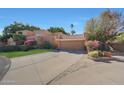 Beautiful home featuring a two-car garage, lovely landscaping and charming curb appeal with concrete driveway at 10648 N 11Th St, Phoenix, AZ 85020