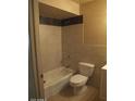 A bathroom with a tiled shower-tub combo, toilet, and vanity at 1113 E Bisnaga St, Casa Grande, AZ 85122