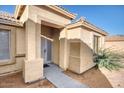 Inviting front entry showcasing well-kept landscaping and a secure screen door for added peace of mind at 1612 E South Mountain Ave, Phoenix, AZ 85042