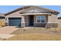 Inviting single-Gathering home boasts a stylish facade and a two-car garage in a well-maintained neighborhood at 17624 W Pierson St, Goodyear, AZ 85395