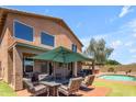 Entertainer's backyard with pool, large patio, outdoor kitchen, and lush turf at 2635 W Angel Way, San Tan Valley, AZ 85144