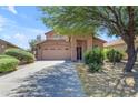 Charming two-story home featuring an attached two-car garage and mature desert landscaping at 2635 W Angel Way, San Tan Valley, AZ 85144