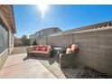 Cozy backyard patio with comfortable seating and a privacy wall, perfect for outdoor relaxation at 2724 S Chaparral Rd, Apache Junction, AZ 85119
