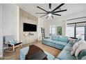 Bright living room with a large sectional sofa, modern ceiling fan, and stylish decor at 2724 S Chaparral Rd, Apache Junction, AZ 85119