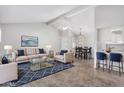 Inviting living room features sleek furniture, and an open layout that flows into the dining area and kitchen at 6270 N 78Th St # 323, Scottsdale, AZ 85250