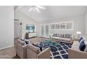 Bright and airy living room featuring vaulted ceilings, modern furniture, and access to the backyard at 6270 N 78Th St # 323, Scottsdale, AZ 85250