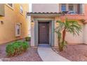 Inviting front entrance with a covered porch and desert landscaping at 7807 W Palm Ln, Phoenix, AZ 85035