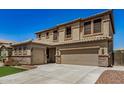 Beautiful home featuring a two-car garage, tile roof, and desert landscaping at 11728 W Villa Hermosa N Ln, Sun City, AZ 85373