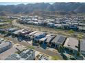 An aerial view of a neighborhood with mountain views and desert landscaping at 727 E Monte Way, Phoenix, AZ 85042