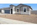 Charming single-story home featuring a two car garage and neutral colored stucco at 12398 E Bahia Ct, Florence, AZ 85132