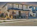 Beautiful two-story home with a stone-accented facade and well-manicured landscaping at 1957 W Lonesome Trl, Phoenix, AZ 85085