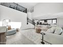 Bright and airy living room features high ceilings and an open floor plan with modern decor at 1957 W Lonesome Trl, Phoenix, AZ 85085