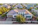 Stunning single-Gathering home featuring a desert landscape, tile roof, and attached three-car garage at 3005 E Valencia Dr, Phoenix, AZ 85042