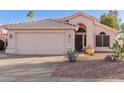 Charming single-story home featuring desert landscaping and a two-car garage at 3403 E Kristal Way, Phoenix, AZ 85050