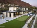 Modern home featuring a rooftop deck, putting green, pool, with views of mountains and greenery at 4725 N 56Th St, Phoenix, AZ 85018