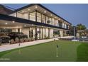 Beautiful modern home featuring a putting green, pool, car port, and mountain views at 4725 N 56Th St, Phoenix, AZ 85018