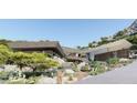 A modern home with desert landscaping and a multi-level design with beautiful desert views at 5648 N Superstition Ln # 5, Paradise Valley, AZ 85253