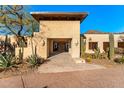 Inviting front entrance with modern design, desert landscaping, and unique architectural details at 6602 N 40Th St, Paradise Valley, AZ 85253