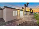 Charming single-story home with manicured front yard, walkway, and beautiful desert landscaping at 701 W Windsor Ave, Phoenix, AZ 85007