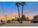 Quaint single-story home close to town with mature shade trees and gated front yard at 701 W Windsor Ave, Phoenix, AZ 85007