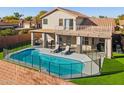 Inviting backyard with pool, patio, lounge chairs, fenced for safety, perfect for relaxation and entertaining at 803 E Rose Marie Ln, Phoenix, AZ 85022