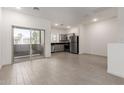 Open living space featuring recessed lights, tile flooring, and sliding glass doors at 8255 N 22Nd Dr, Phoenix, AZ 85021