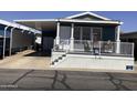 The exterior of the home features a covered parking space and covered porch at 8700 E University Dr # 1610, Mesa, AZ 85207